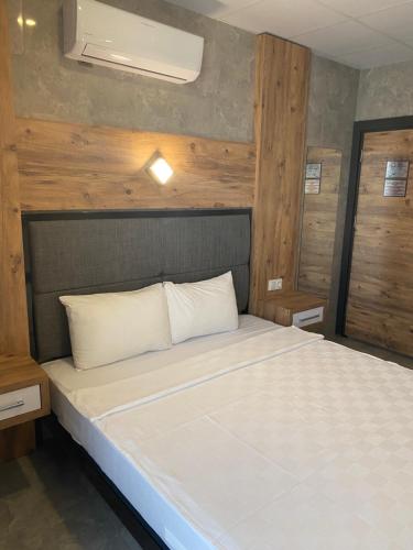 Letto o letti in una camera di M-ODA OTEL