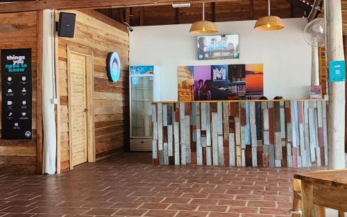 a room with wooden walls and a counter at Mad Monkey Koh Rong in Koh Rong Island