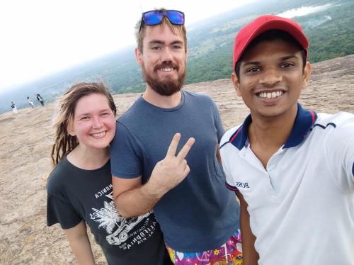 a group of people posing for a picture at the beach at Jaana Guest in Sigiriya