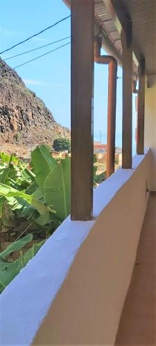 a view of a building with a view of the ocean at Casa Pepito in Agulo