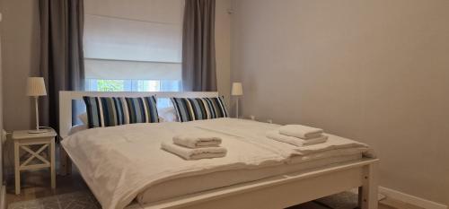 Postel nebo postele na pokoji v ubytování Navigare Apartment