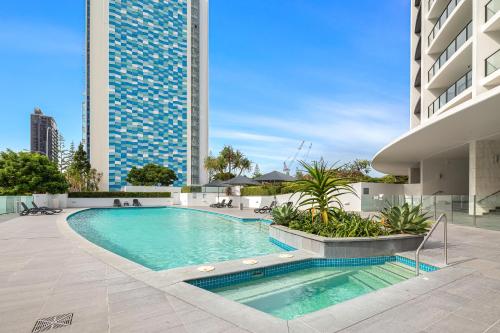 a swimming pool on the side of a building at Sierra Grand Apartments - Hosted by Wow Stay in Gold Coast