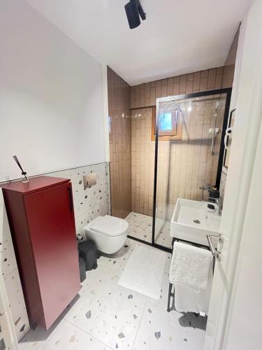 a bathroom with a toilet and a sink at The Pillo Mansion in Istanbul