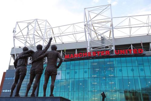 a statue in front of a soccer stadium at A wonderful room in Sale