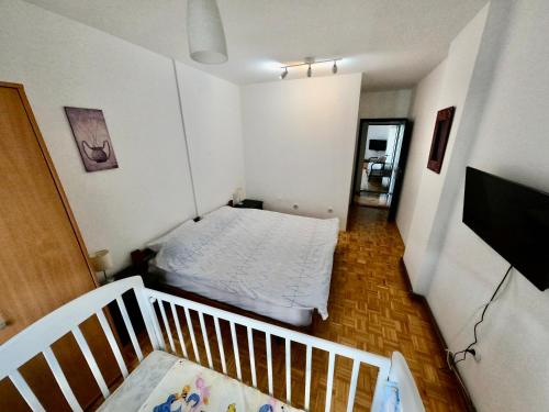 a small bedroom with a bed in a room at Filip Apartments in Soko Banja