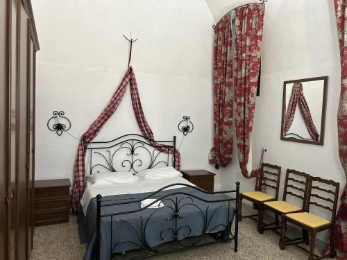 Ein Bett oder Betten in einem Zimmer der Unterkunft Lo Scudo - Castellana Grotte