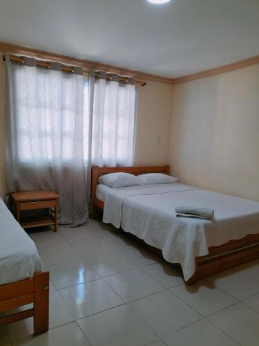 Cama o camas de una habitación en Posada Yasa sarie bay