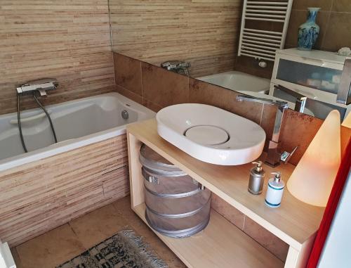 a bathroom with a toilet and a tub and a sink at Bella Vista Lux Apartment with private Terace in Koper