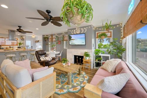 a living room with a couch and a table at Little “house” right on the beach in Hollywood