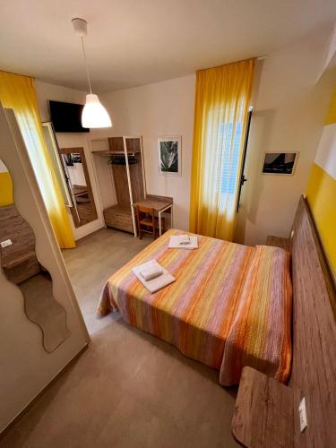 a bedroom with a large bed in a room at Hotel Lido Vieste in Vieste