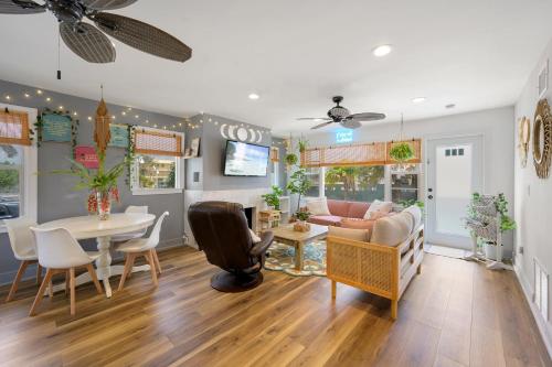 a living room with a table and a couch at Little “house” right on the beach in Hollywood