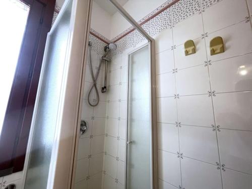 a bathroom with a shower and a mirror at Apt. Montesanto Sunset, 300Mt from city centre. in Pula