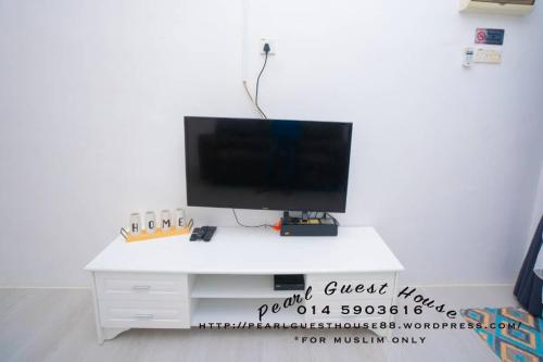 TV a/nebo společenská místnost v ubytování Pearl Guest House