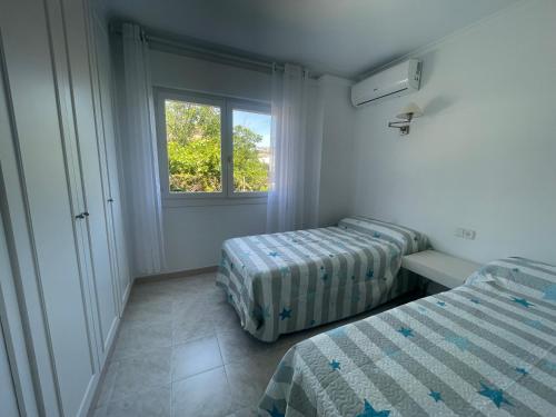 Ένα ή περισσότερα κρεβάτια σε δωμάτιο στο Casa Olé