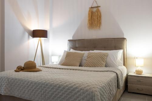 a bedroom with a bed with a hat on it at Casa il Megliore in Argostoli