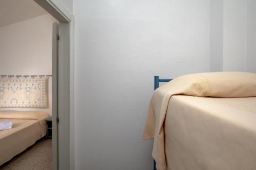 Postel nebo postele na pokoji v ubytování Hotel Castello