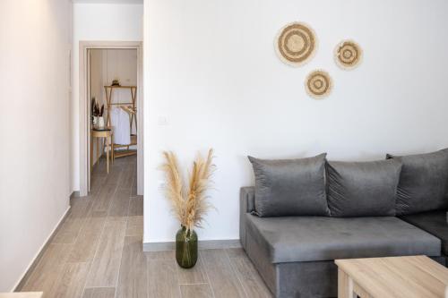a living room with a couch and a table at Casa il Megliore in Argostoli