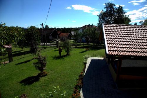 a view of a yard with a roof at Brezova Poljana Lodge in Vrbovsko