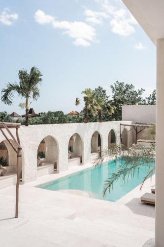 a pool at the resort at Hotel Sages in Canggu