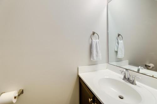 a bathroom with a sink and a mirror at Havelock Home Private Yard, 2 Mi to Cherry Point! in Havelock