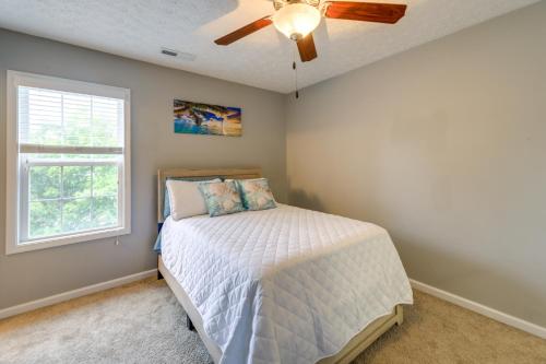 a bedroom with a bed and a ceiling fan at Havelock Home Private Yard, 2 Mi to Cherry Point! in Havelock