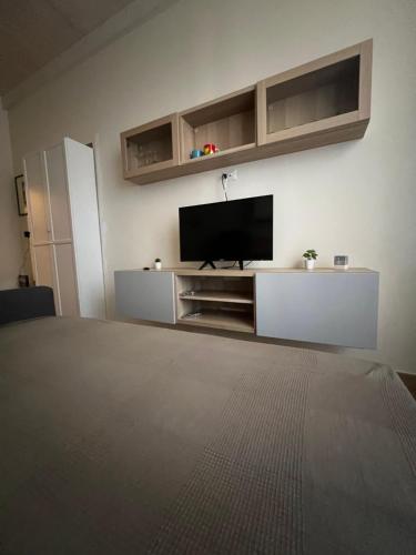a living room with a flat screen tv on a wall at Sea apartments2 in Terracina