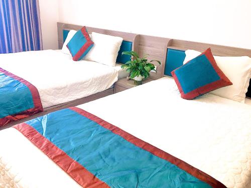 Katil atau katil-katil dalam bilik di LONG VŨ HOTEL
