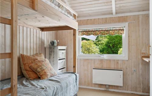 a bedroom with a bunk bed and a window at Amazing Home In Hornbæk With Kitchen in Hornbæk