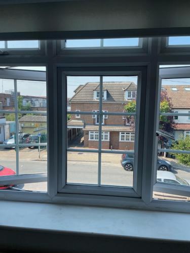 a window with a view of a street at Birkbeck House in Beckenham
