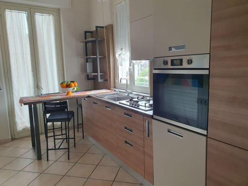a kitchen with a stove and a counter top at Unico Gravina in Gravina di Catania