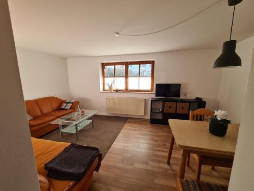 a living room with a couch and a table at Altmühltaler Ferienwohnung in Beilngries