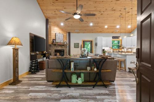 a kitchen and living room with a ceiling fan at Stunning Views, Superb Atmosphere, Modern Amenities, In the Middle of Nature in Bryson City