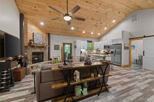 a kitchen and living room with a ceiling fan at Stunning Views, Superb Atmosphere, Modern Amenities, In the Middle of Nature in Bryson City