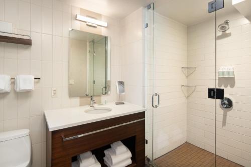 a bathroom with a sink and a shower at Residence Inn by Marriott New York Manhattan/ Midtown Eastside in New York
