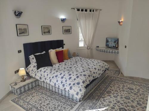 Katil atau katil-katil dalam bilik di Villa POUR VACANCES JASMIN