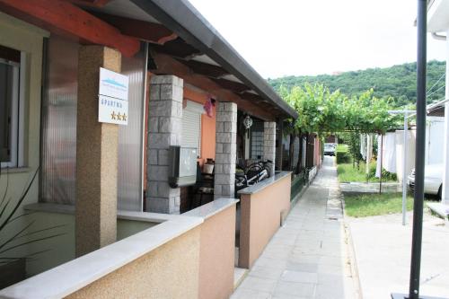 a building with a sign on the side of it at Small house apartment in Koper