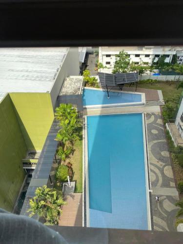 an overhead view of a swimming pool on a building at 1 BR Centrio Tower 926 in Cagayan de Oro