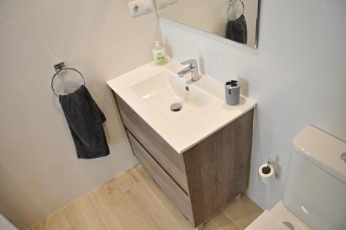 a bathroom with a sink and a toilet at Centro Sitges in Sitges