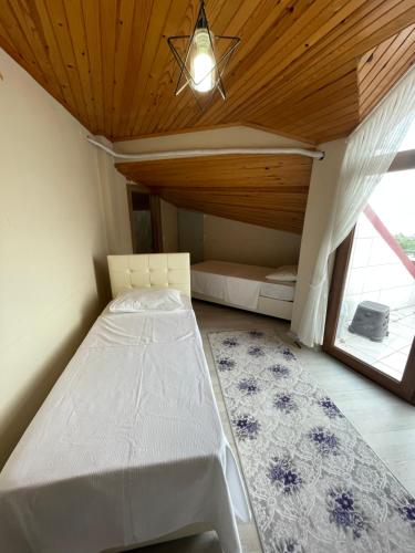 Ένα ή περισσότερα κρεβάτια σε δωμάτιο στο Anatolia SUITE APART