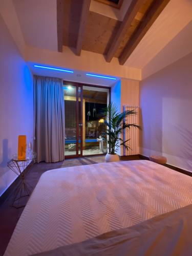 a bedroom with a large bed with blue lights at Villa LORY in Castellammare di Stabia