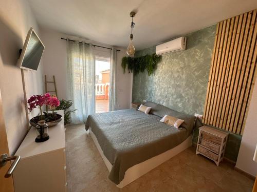 a bedroom with a large bed in a room at La casa Latina in Vinarós