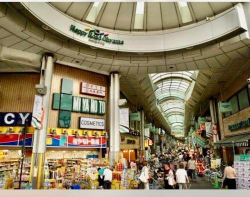 a large market with people walking around in a building at 池袋三駅の家 大山駅から徒歩4分 in Tokyo
