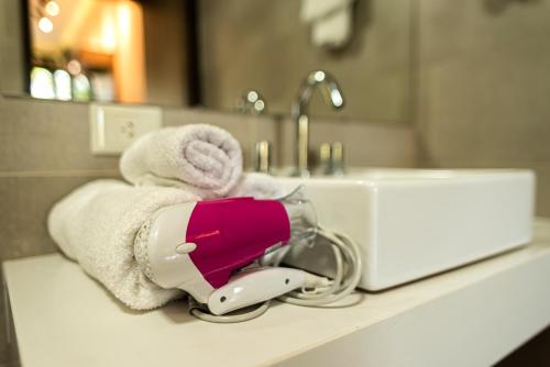 a hairdryer sitting on a counter in a bathroom at Tekoa Lodge in Puerto Iguazú