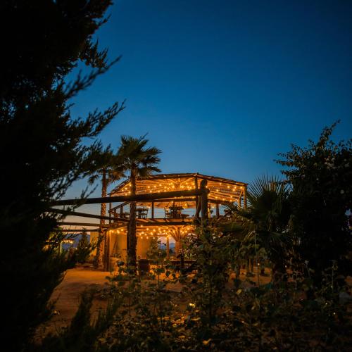 a lit up house at night with lights at Cuatro Lunas Hotel Boutique in Valle de Guadalupe