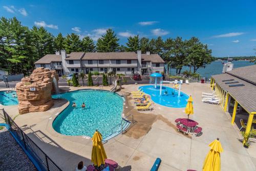a large swimming pool with a water park at Caribbean Club Resort in Wisconsin Dells