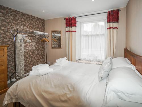 מיטה או מיטות בחדר ב-The Rennie Mackintosh Retreat