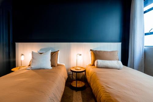 Letto o letti in una camera di The Cobbler Hotel