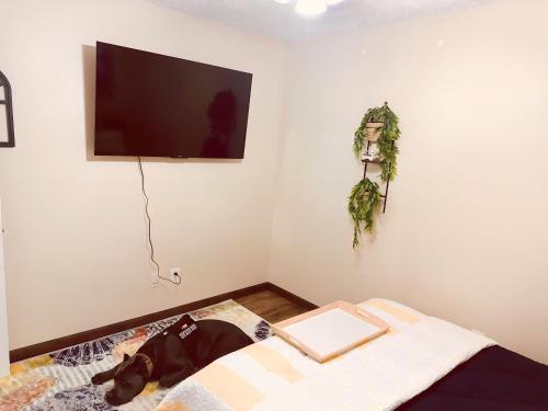 a bedroom with a bed with a book on it at Jet Skis, Lake View, Sleeps 8, HotTub, Firepit, Pet Friendly! in Canyon Lake