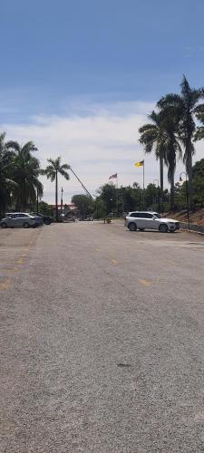 an empty parking lot with a car parked on the street at Port Dickson Seaview Homestay in Port Dickson