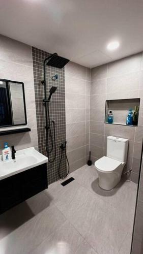 a bathroom with a shower and a toilet and a sink at Nordic685 Homestay @ Bandar Baru Sg Buloh in Sungai Buluh